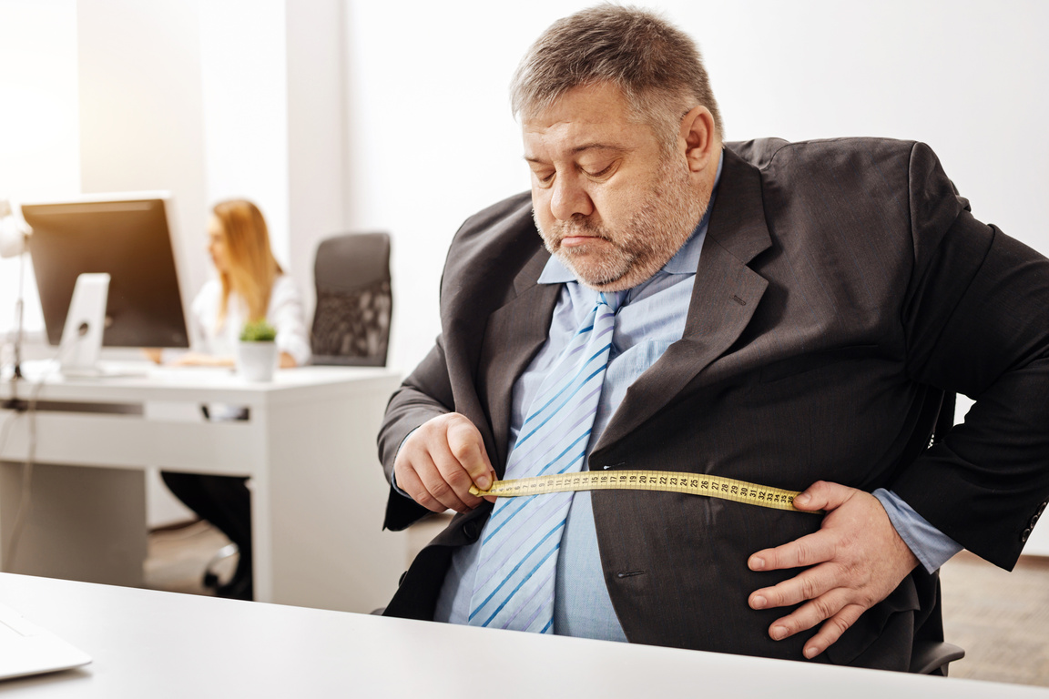 Hardworking employee suffering from excess weight